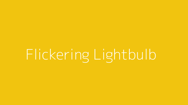 A close-up of a lightbulb that is flickering on and off, symbolizing an electrical problem.